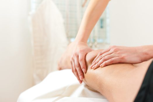 Patient at the physiotherapy gets massage or lymphatic drainage